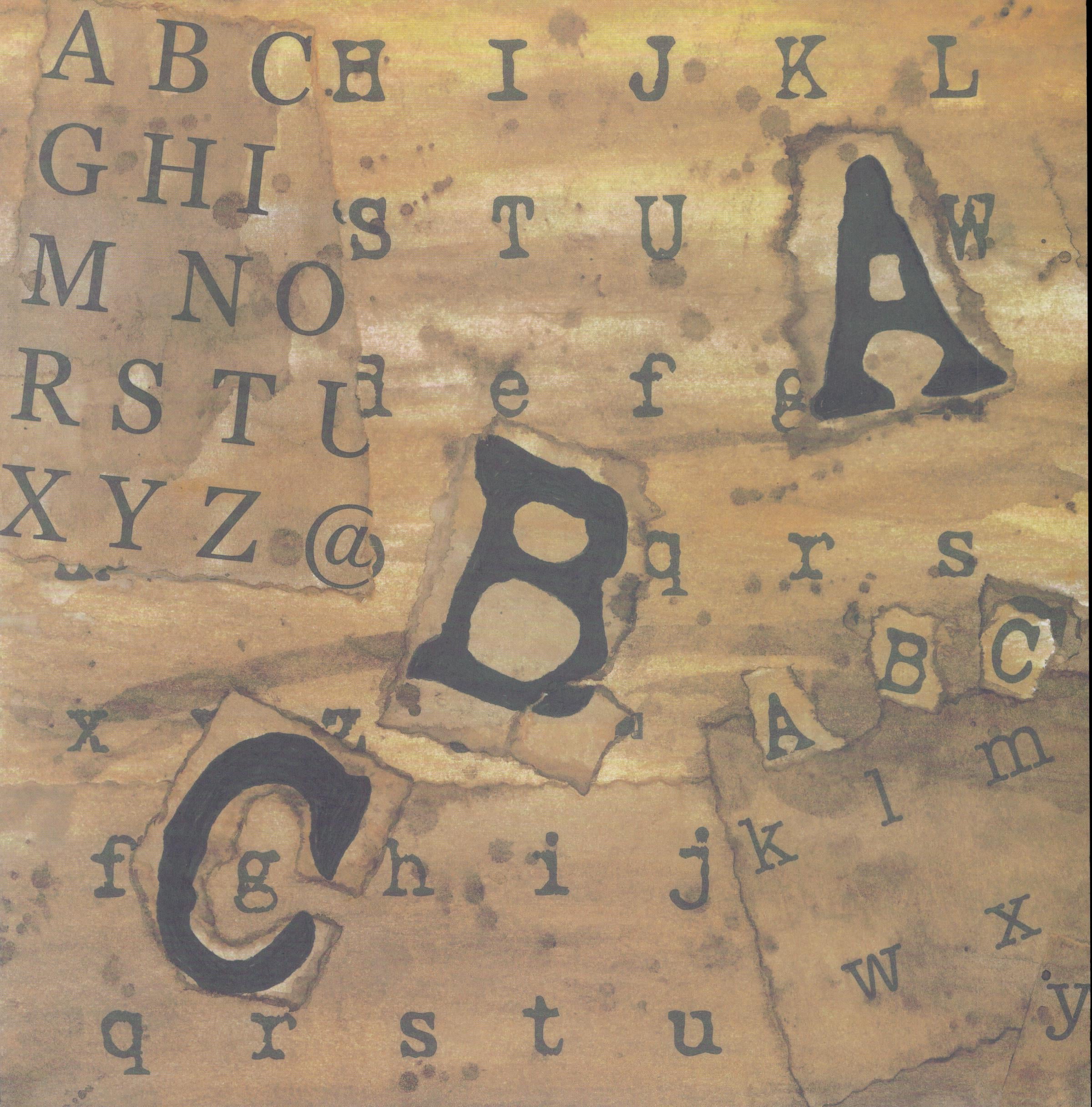 Design Originals Walnut ABCs 12x12 scrapbook paper with dramatic alphabet letter collage in typewriter and serif styles on torn paper layers in walnut brown and golden amber