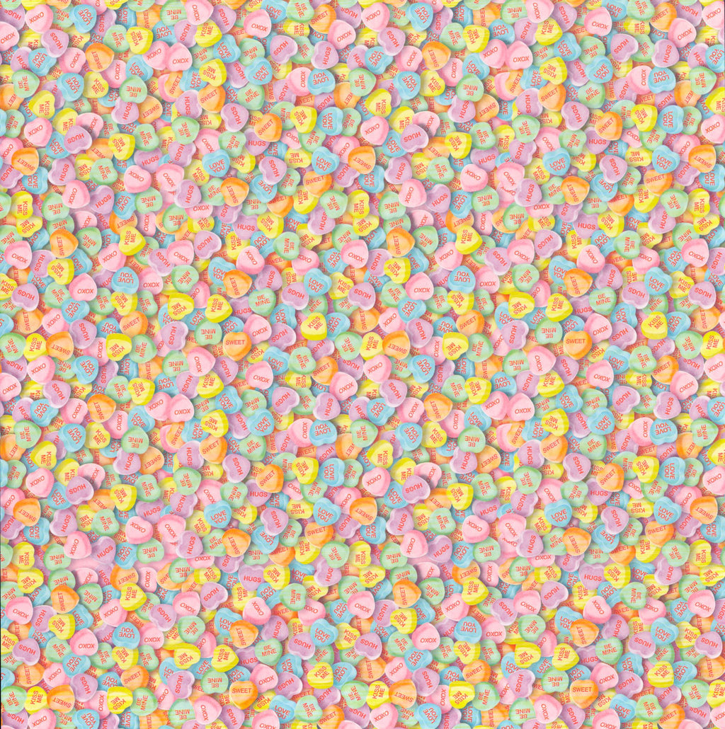 The Paper Studio Candy Hearts 12x12 scrapbook paper - edge-to-edge photorealistic pastel candy conversation hearts in pink, blue, yellow, orange, lavender, and mint with XOXO, Hugs, Kiss Me, Be Mine messages